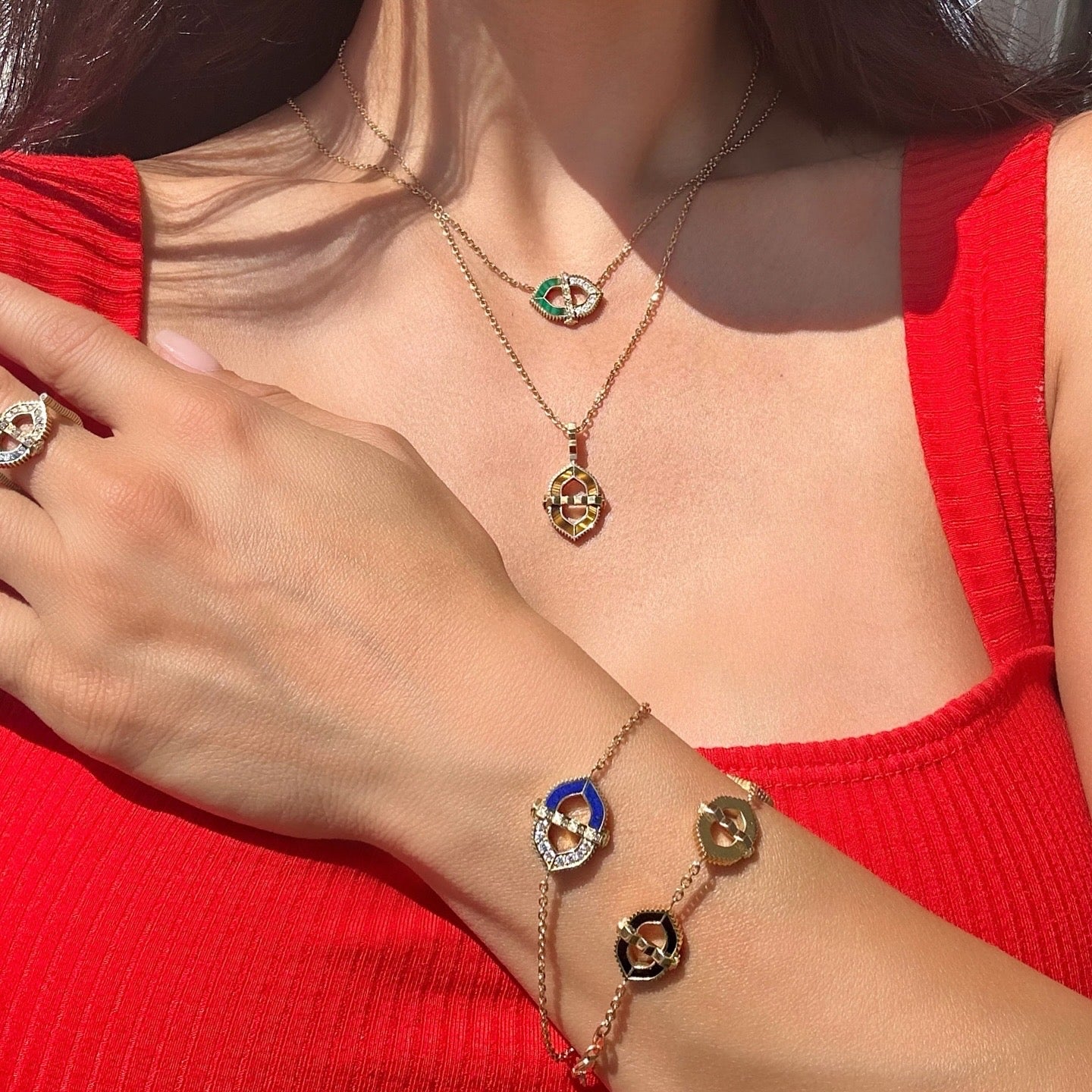 18 karat gold bastion necklace and bracelet with gemstones malachite lapis lazuli tiger's eye and onyx vardui kara