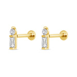 Gold earrings with clear gemstones on a white background