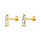 Gold earrings with clear gemstones on a white background