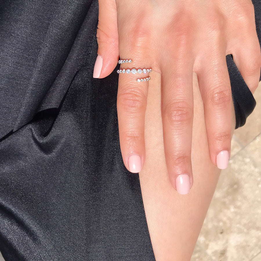 spiral diamond cluster ring on finger